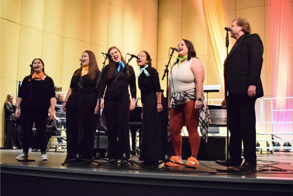 A group of people singing.