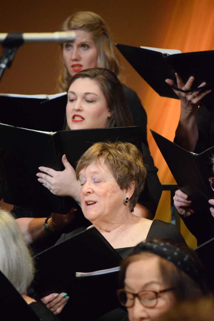 A group of choir members singing.